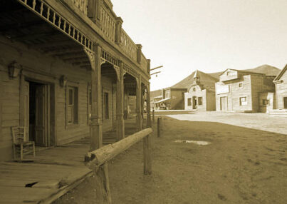 Wild West, old wooden buildings, houses, sepia toned.